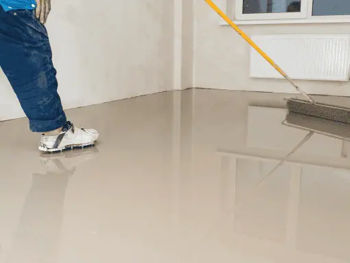 applying floor epoxy using a brush